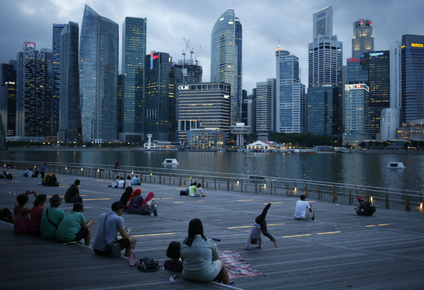 People wait to watch a laser light show along Marina Bay overlooking the central business district in the evening in Singapore May 28, 2014.u00e2u20acu201d Reuters pic