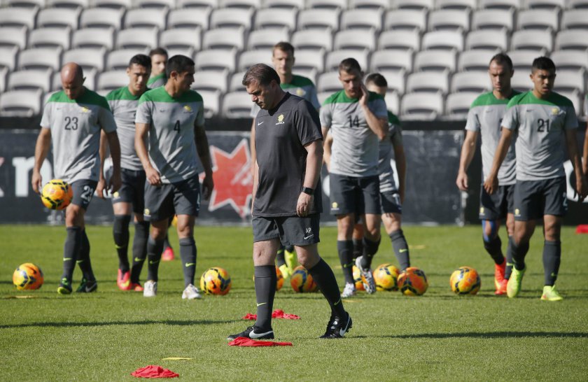Australian national football team Socceroos coach Ange Postecoglou (centre) walks with players during a training session in Sydney May 23, 2014. u00e2u20acu201d Reuters pic