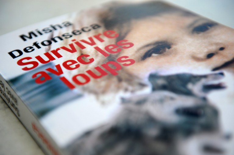 A picture taken on February 29 2008 in Paris, shows the best-seller book of Belgian author, known as Misha Defonseca, u00e2u20acu02dcSurviving with Wolvesu00e2u20acu2122, about how she was adopted by wolves after her parents were seized by the Nazis in 1941. u00e2u20acu201d AFP pic