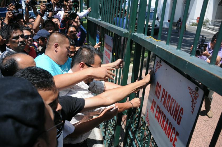 Umno protesters push the gates of the Penang state assembly building in George Town May 21, 2014. u00e2u20acu201d Picture by K.E. Ooi