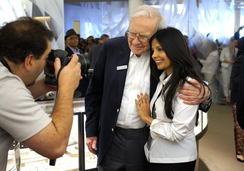 Berkshire Hathaway CEO Warren Buffett poses with Tinku Jain at the Berkshire-owned Borsheims jewellery store where Buffett was selling jewellery as part of the company annual meeting in Omaha, May 4, 2014. u00e2u20acu201d Reuters pic