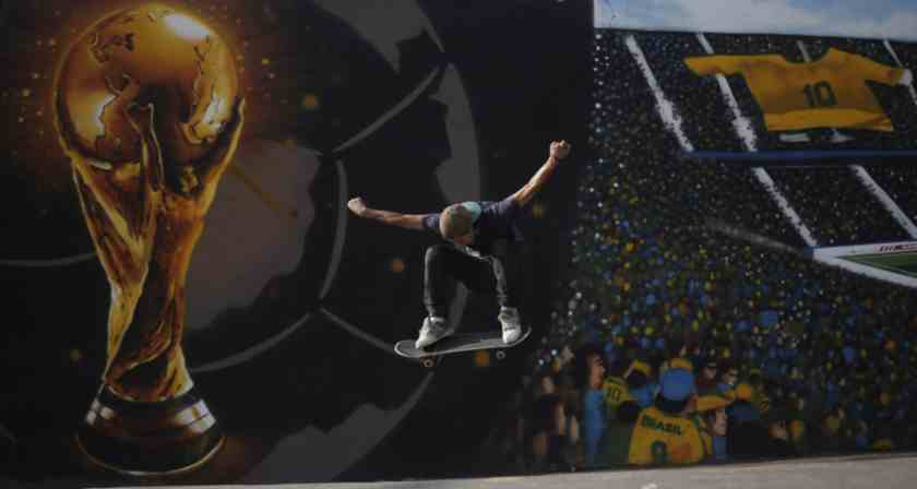 Juliano Ferrari performs with his skateboard next to a graffiti of the World Cup trophy and Brazil soccer fans, referring to the upcoming 2014 World Cup soccer tournament, in Sao Paulo May, 20  2014.  u00e2u20acu201d Reuters pic