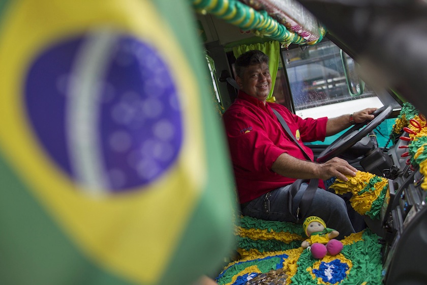 Bus driver Raimundo Queiroz sits at the wheel of the bus that he and his wife, who are its owners and only drivers, decided to decorate for the 2014 World Cup in Manaus, May 21, 2014. u00e2u20acu201du00c2u00a0Reuters pic