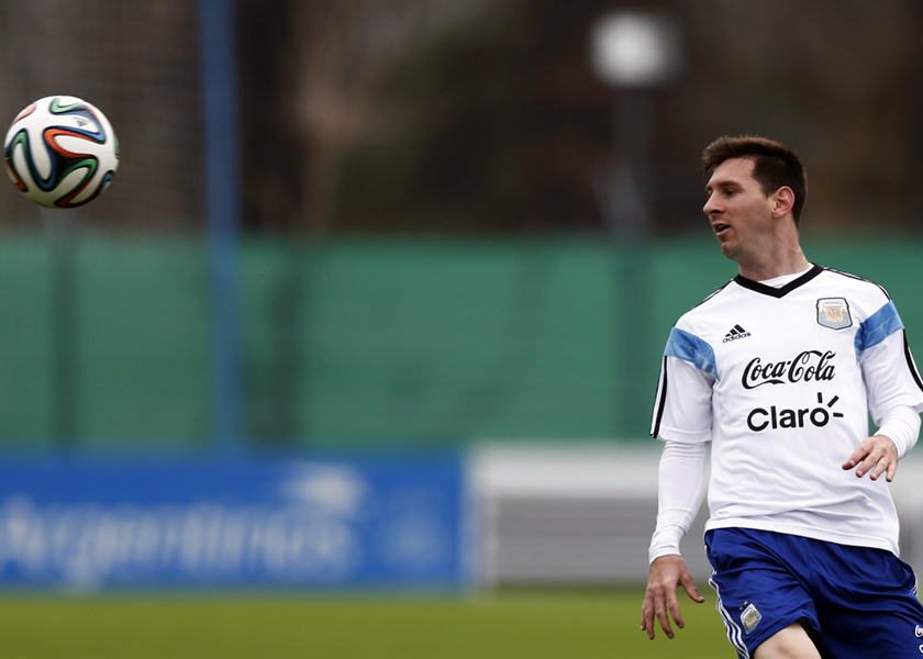 Argentina's national soccer team player Lionel Messi watches the ball during a training session at the squad's camp ahead of the 2014 World Cup in Buenos Aires, May 31, 2014. u00e2u20acu201d Reuters pic