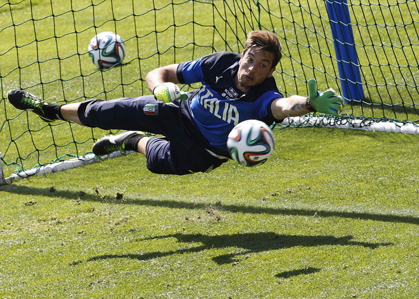 Italy's national soccer team goalkeeper Antonio Mirante makes a save during a training session at Coverciano training centre near Florence, May 21, 2014. u00e2u20acu201d Reuters pic