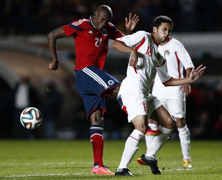 Colombiau00e2u20acu2122s Victor Ibarbo (left) kicks Jordan's Rajaei Ayed Fadel as he misses the ball during their international friendly soccer match ahead of the 2014 World Cup in Buenos Aires June 7, 2014. u00e2u20acu201d Reuters pic