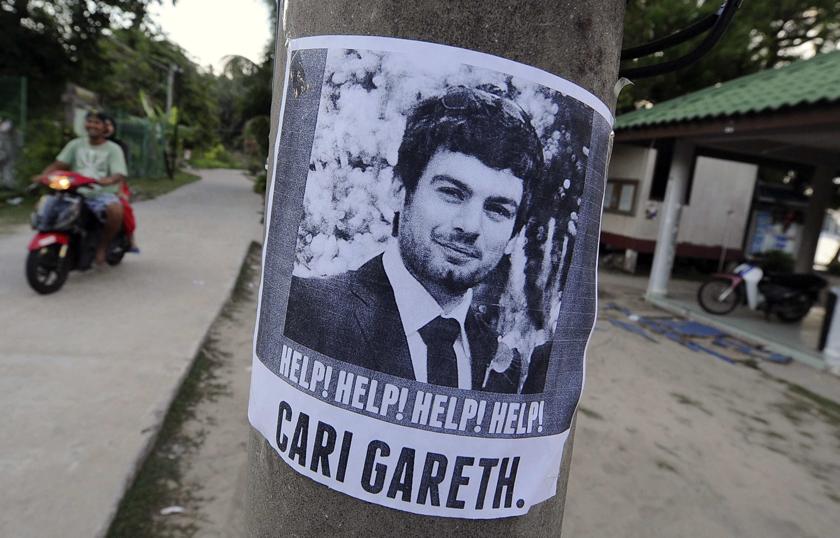 A poster of missing British man Gareth Huntley, 34, is seen at Juara village on Tioman Island June 4, 2014. Huntley, who was volunteering in Malaysia, was reported missing from Tioman Island on May 27. u00e2u20acu201d Reuters pic