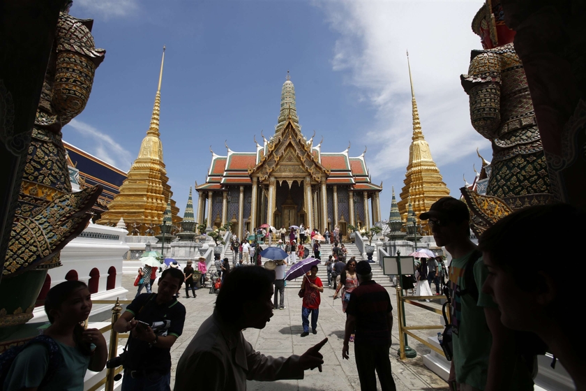 Tourists visit the Grand Palace in Bangkok May 24, 2014. u00e2u20acu201d Reuters pic