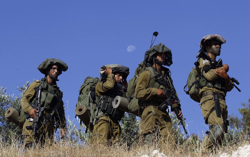 Israeli soldiers take part in an operation to locate three Israeli teens near the West Bank City of Hebron June 17, 2014. u00e2u20acu201d Reuters pic
