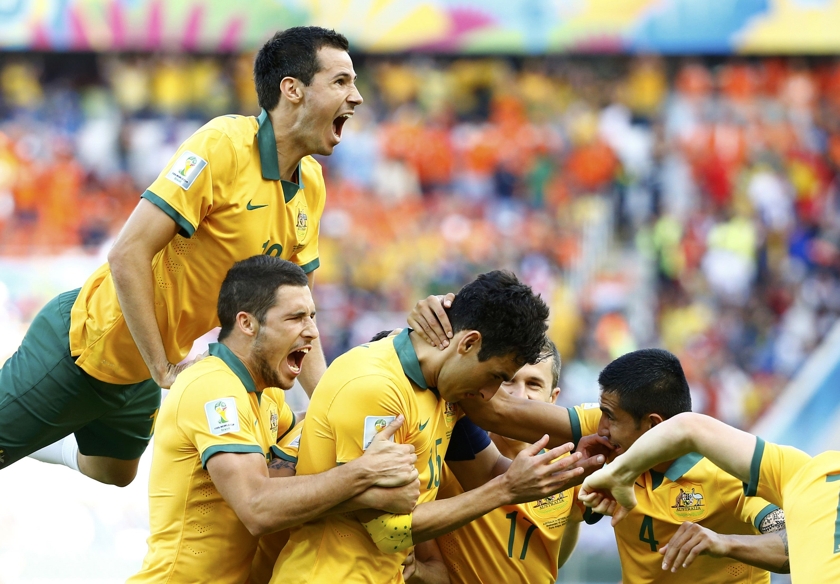 Australia's Mile Jedinak (centre) celebrates after scoring a goal against Netherlands during their 2014 World Cup Group B soccer match at the Beira Rio stadium in Porto Alegre June 18, 2014. u00e2u20acu201d Reuters pic