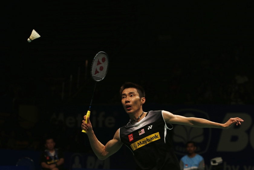 Lee Chong Wei prepares to return a shot to Japan's Kenichi Tago during their men's singles semi-final match at the Indonesia Open badminton championship in Jakarta June 21, 2014. u00e2u20acu201d Reuters pic