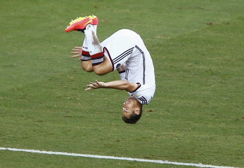 Germany's Miroslav Klose executes a sommersault as he celebrates scoring a goal against Ghana during their 2014 World Cup Group G football match at the Castelao arena in Fortaleza June 22, 2014. u00e2u20acu201d Reuters pic