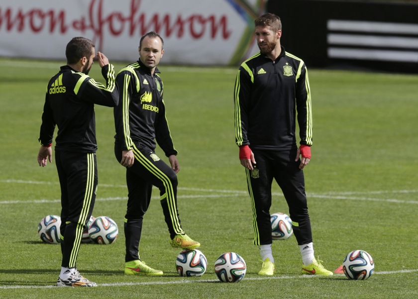 Spain's player Andres Iniesta (centre) and Sergio Ramos (right) speak with teammate Jordi Alba during a training session in Curitiba, June 21, 2014. u00e2u20acu201d Reuters pic