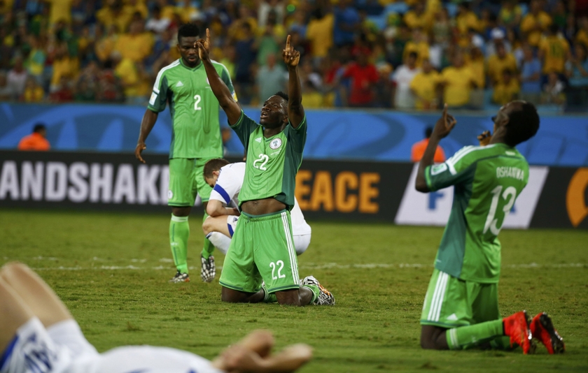 Nigeria's national football players Nigeria's Kenneth Omeruo (centre) and Juwon Oshaniwa (right) celebrate their victory over Bosnia during their 2014 World Cup Group F football match at the Pantanal arena in Cuiaba June 21, 2014. u00e2u20acu201d Reuters pic