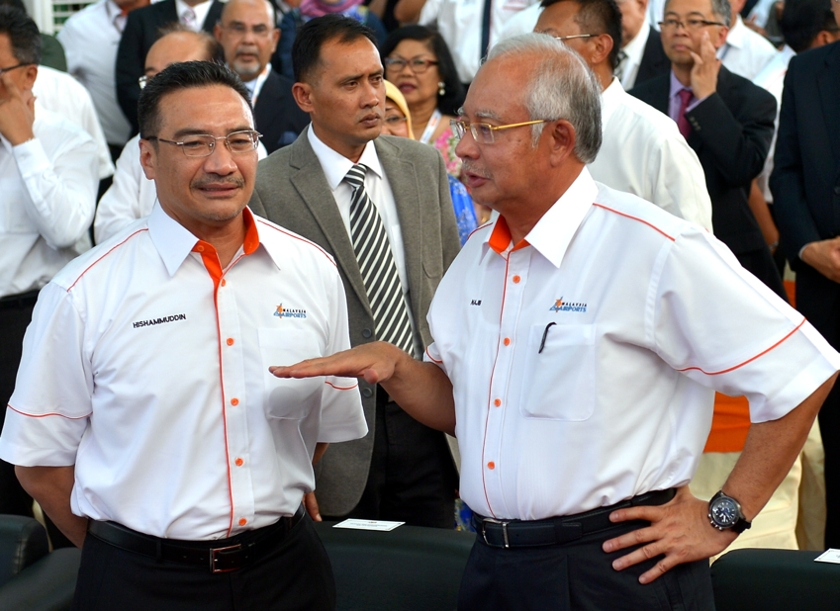 Prime Minister Datuk Seri Najib Razak (right) speaks acting Transport Minister Datuk Seri Hishammuddin Hussein during the launch of KLIA2 in Sepang, June 24, 2014. u00e2u20acu201d Bernama pic