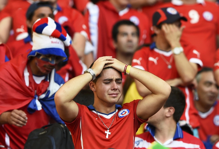 A fan of Chile reacts after losing their 2014 World Cup round of 16 game against Brazil at the Mineirao stadium in Belo Horizonte June 28, 2014. u00e2u20acu201d Reuters pic
