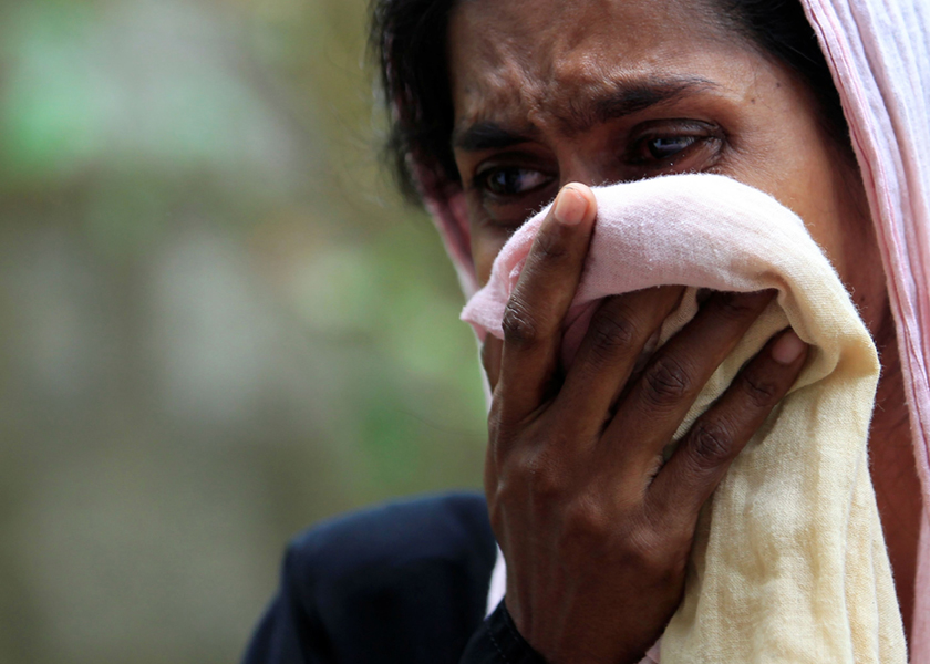 A Muslim woman cries next to her burnt house after a clash between Buddhists and Muslims in Aluthgama, June 21, 2014. u00e2u20acu201d Reuters pic
