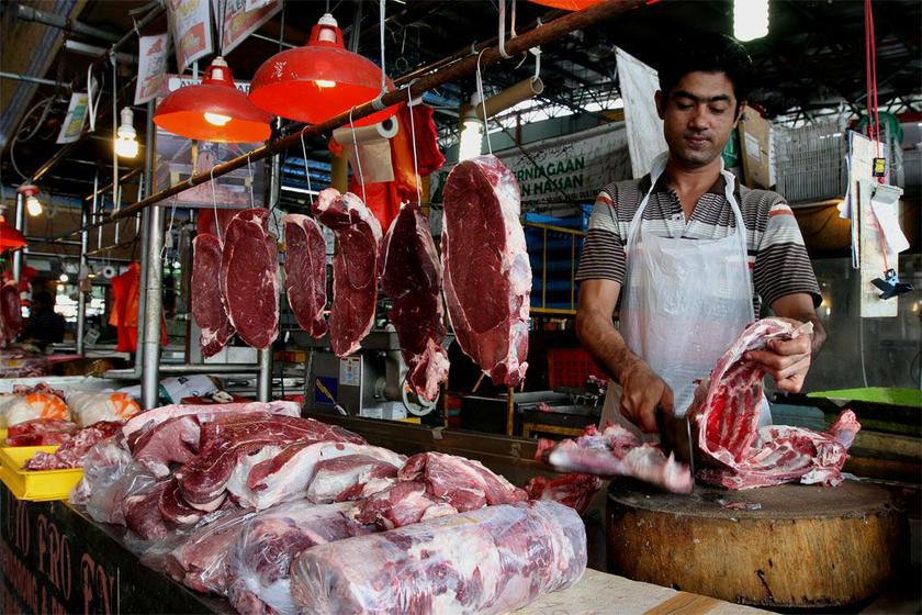 A butcher is seen cutting meat at the Pasar Borong Selangor in Seri Kembangan, Selangor. u00e2u20acu201dPicture by Yusof Mat Isa