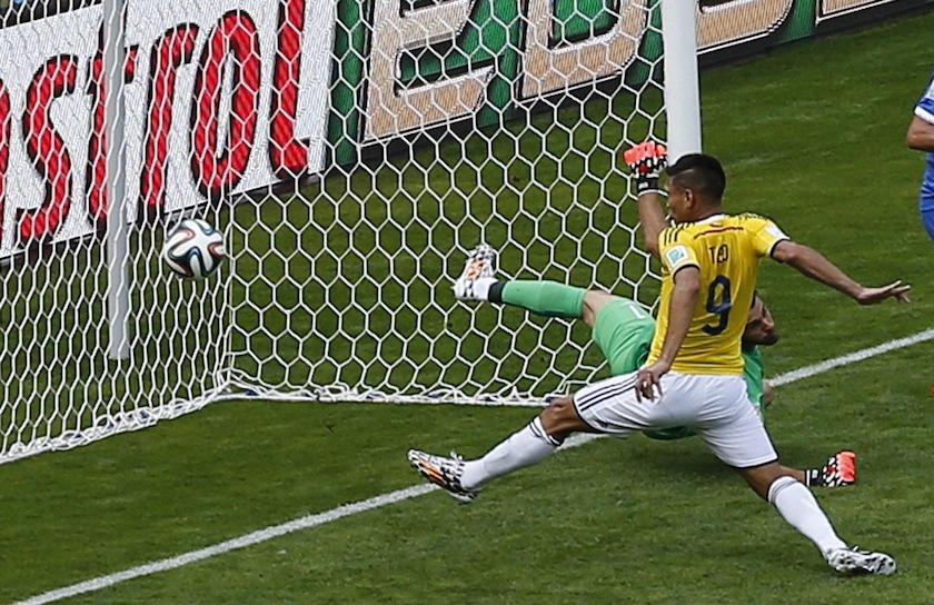 Colombia's Teofilo Gutierrez (9) scores past Greece's goalkeeper Orestis Karnezis during their 2014 World Cup Group C match at the Mineirao stadium in Belo Horizonte June 15, 2014.u00c2u00a0u00e2u20acu201du00c2u00a0Reuters pic