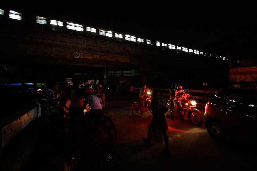 India commuters ride on a dark street following a power outage in Kolkata, India Reuters