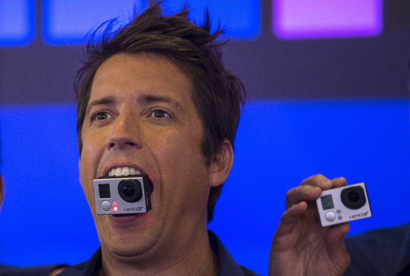 GoPro Inc's founder and CEO Nick Woodman holds a GoPro camera in his mouth as he celebrates GoPro Inc's IPO at the Nasdaq Market Site in New York City, June 26, 2014 Reuters
