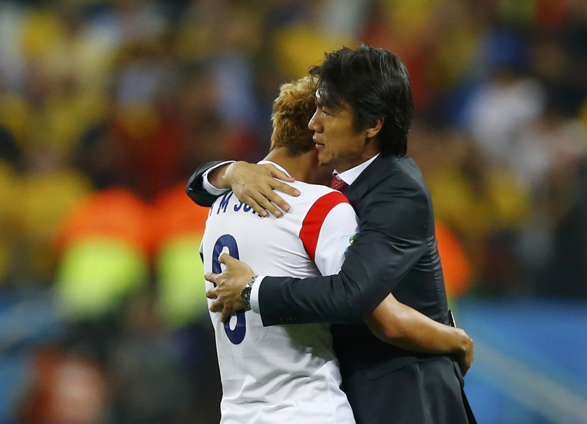 South Koreau00e2u20acu2122s Son Heung-min (left) is consoled by coach Hong Myung-bo after their World Cup Group H match loss to Belgium at the Corinthians arena in Sao Paulo June 26, 2014. u00e2u20acu201d Reuters pic