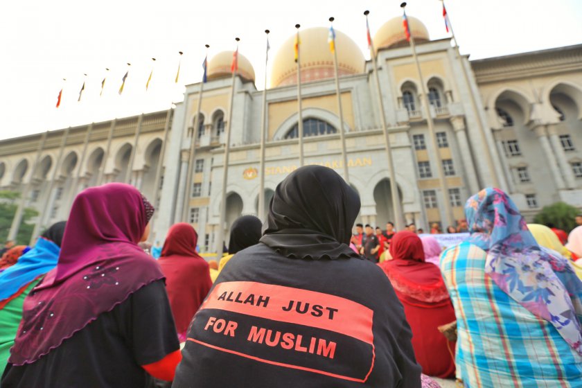 Muslims gather outside the Federal Court building in Putrajaya on June 23, 2014 when the court heard the Catholic Churchu00e2u20acu2122s application for leave to appeal.  u00e2u20acu201d Picture by Saw Siow Feng