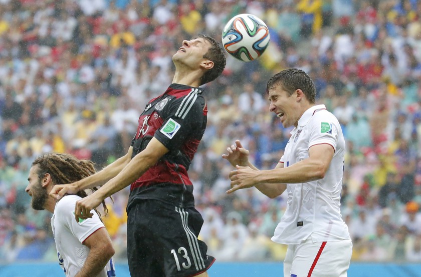 Kyle Beckerman (left) and Matt Besler of the US jump for the ball with Germanyu00e2u20acu2122s Thomas Mueller (centre) during their Group G match at the Pernambuco arena in Recife June 26, 2014. u00e2u20acu201d Reuters pic