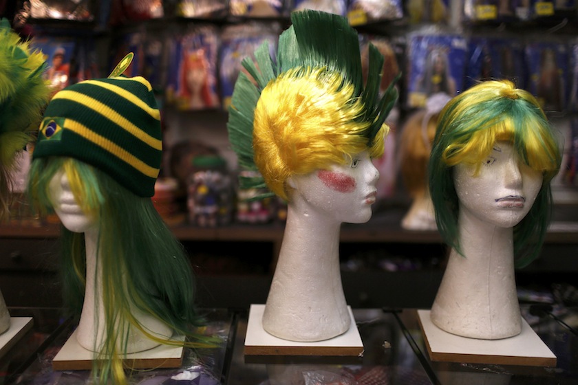 Wigs in the colours of team Brazil are displayed at a souvenir shop in a Rio de Janeiro market June 10, 2014. u00e2u20acu201d Reuters pic