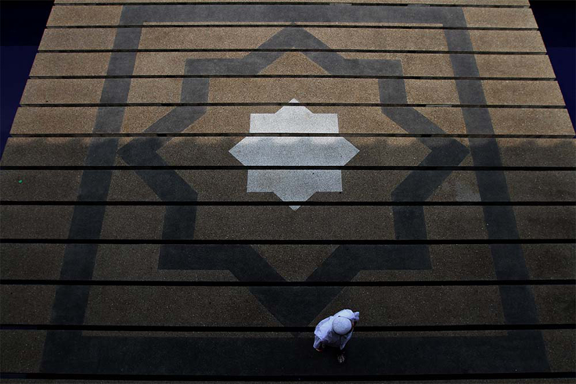 A man walking into the National Mosque for perform Friday prayers, on June 27, 2014. u00e2u20acu201d Picture by Yusof Mat Isa