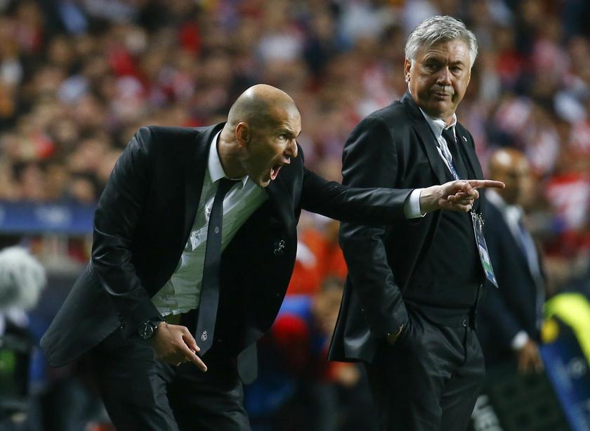 Real Madridu00e2u20acu2122s coach Carlo Ancelotti (right) watches his assistant Zinedine Zidane shout at their players during their Champions League final match against Atletico Madrid at Luz stadium in Lisbon, May 24, 2014. u00e2u20acu201d Reuters pic