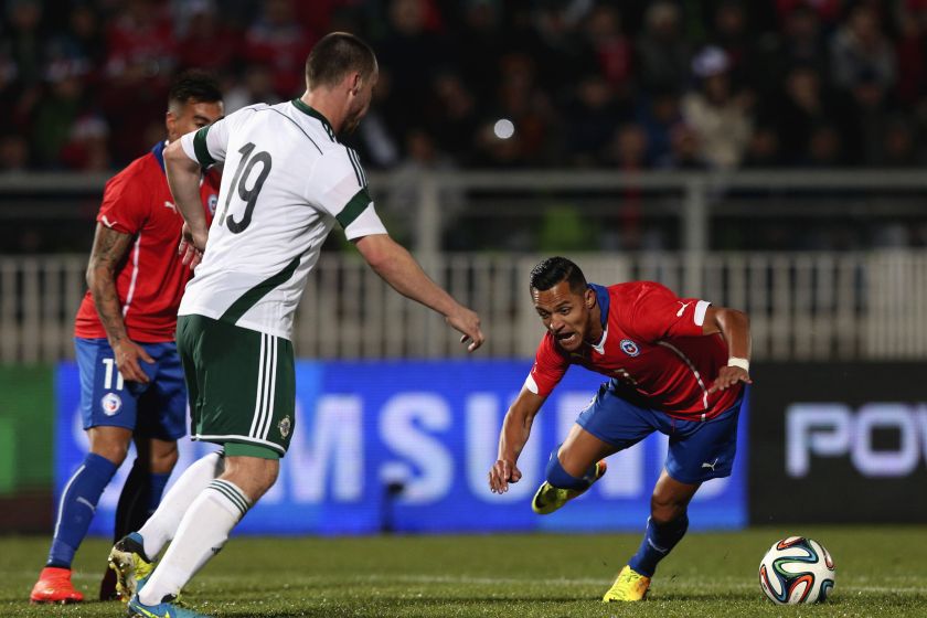 Chile's Alexis Sanchez (right) fights for the ball with Northern Ireland's Luke McCullough during their international friendly football match at Elias Figueroa stadium in Valparaiso June 4, 2014. u00e2u20acu201d Reuters pic