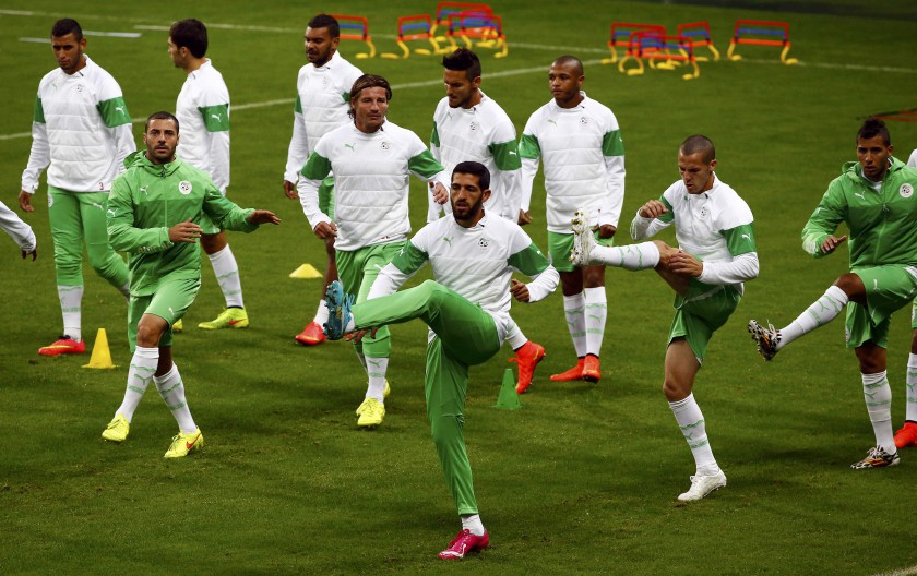 Algeria's Rafik Halliche (centre) attends a training session with his teammates at the Arena do Gremio in Porto Alegre June 29, 2014. Algeria will meet Germany for their 2014 World Cup round of 16 game, June 30. u00e2u20acu201dReuters pic