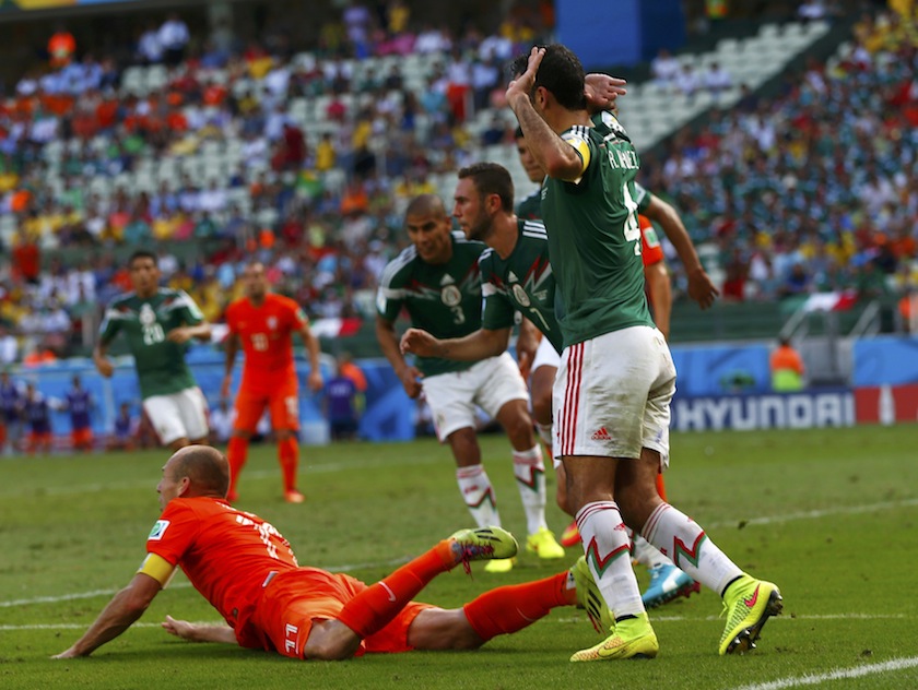 Arjen Robben of the Netherlands is fouled in the penalty area during their 2014 World Cup round of 16 game against Mexico at the Castelao arena in Fortaleza June 30, 2014.u00c2u00a0u00e2u20acu201du00c2u00a0Reuters pic