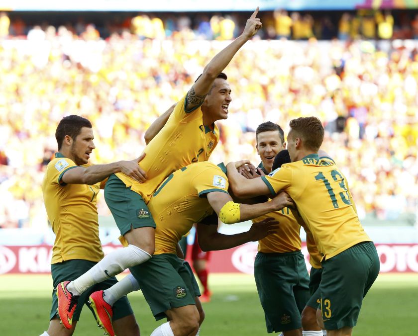 Australia's Mile Jedinak (3rd left) celebrates with his teammates after scoring a goal against Netherlands during their 2014 World Cup Group B football match at the Beira Rio stadium in Porto Alegre June 19, 2014. u00e2u20acu201d Reuters pic