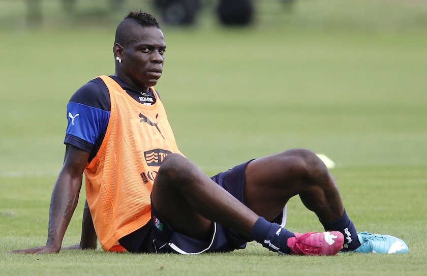 Italy's national player Mario Balotelli looks on as he sits on the pitch during a training session ahead of the 2014 World Cup at the Portobello training centre in Mangaratiba June 11, 2014.u00c2u00a0u00e2u20acu201du00c2u00a0Reuters pic