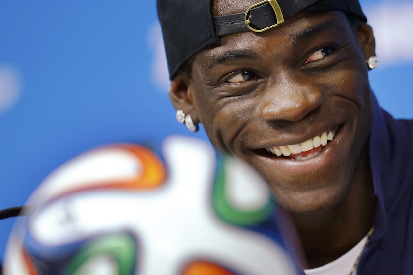 Italy's national team player Mario Balotelli smiles while answering a question during an news conference at the Pernambuco arena in Recife, June 19, 2014.u00c2u00a0u00e2u20acu201du00c2u00a0Reuters pic