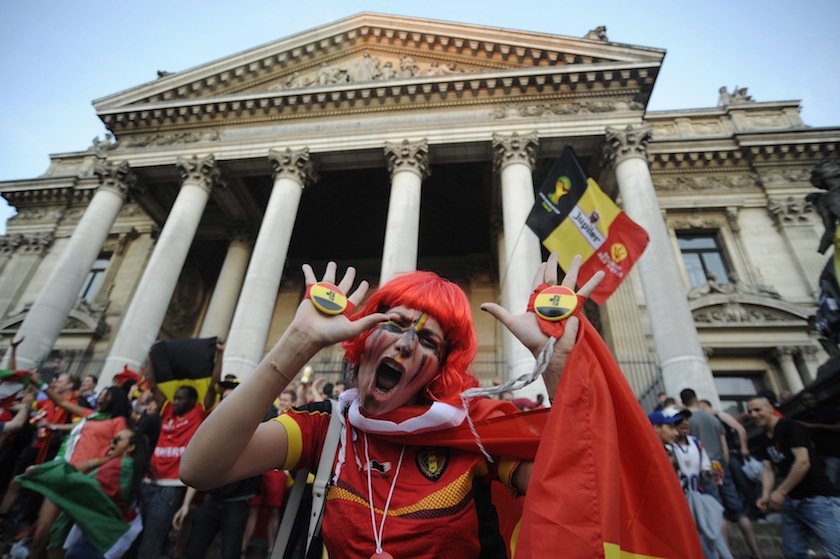 A Belgian supporter reacts in celebration of the team's victory over Russia during their 2014 World Cup Group H match, in front of the Stock Exchange in Brussels June 23, 2014.u00c2u00a0u00e2u20acu201du00c2u00a0Reuters pic
