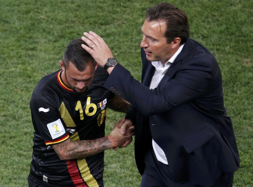 Belgiumu00e2u20acu2122s coach Marc Wilmots consoles Steven Defour (left) after he was sent off with a red card during their World Cup Group H match against South Korea at the Corinthians arena in Sao Paulo June 26, 2014. u00e2u20acu201d Reuters pic