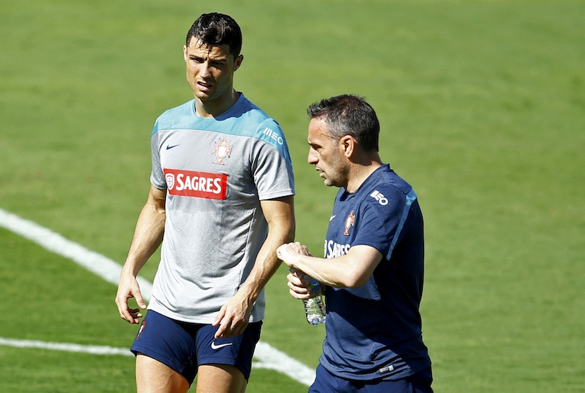 Portugalu00e2u20acu2122s Cristiano Ronaldo talks with coach Paulo Bento during an open training session in Campinas, June 18, 2014. u00e2u20acu201d Reuters pic