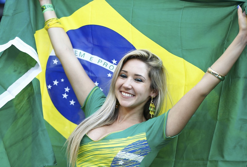 A fan holds up the Brazilian national flag as she waits for the 2014 World Cup opening match between Brazil and Croatia at the Corinthians arena in Sao Paulo June 12, 2014. u00e2u20acu201du00c2u00a0Reuters pic