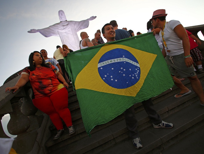 Tourists pose for photographs at the statue of Christ the Redeemer ahead of the 2014 World Cup in Rio de Janeiro, June 8, 2014.u00c2u00a0u00e2u20acu201d Reuters pic