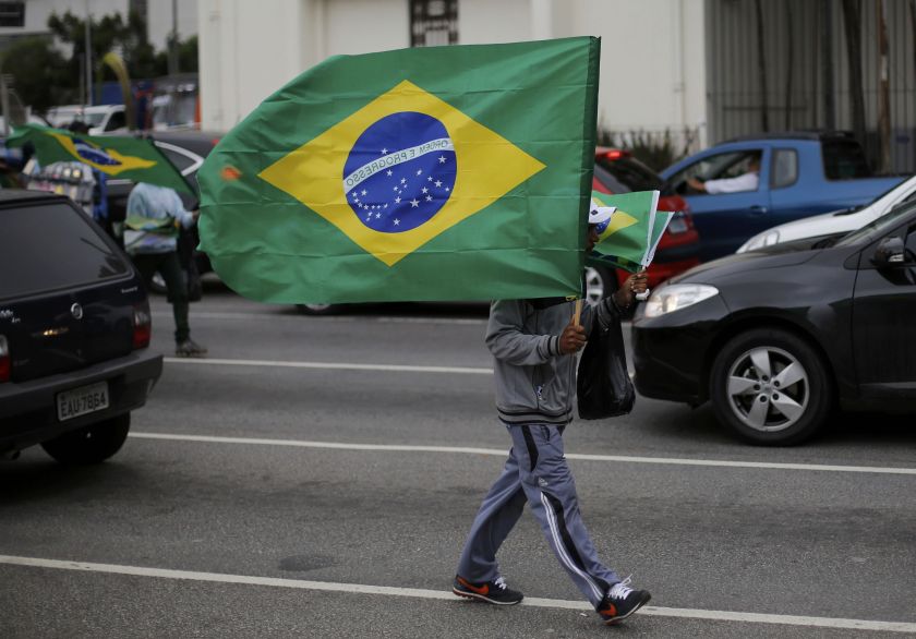 Vendors sell Brazilian flags on a street in Sao Paulo, June 10, 2014. u00e2u20acu201d Reuters pic