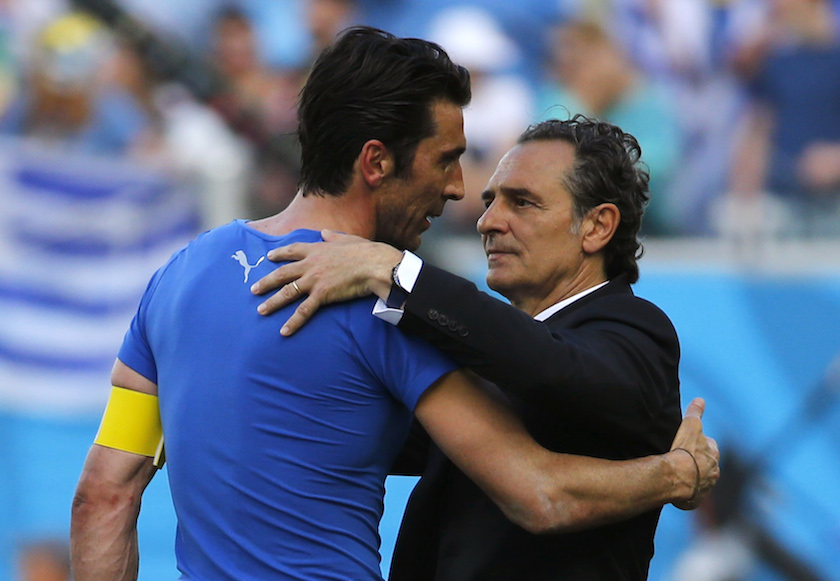 Italyu00e2u20acu02dcs goalkeeper Gianluigi Buffon and coach Cesare Prandelli hug after the 2014 World Cup Group D match between Uruguay and Italy at the Dunas arena in Natal June 24, 2014. u00e2u20acu201d Reuters pic