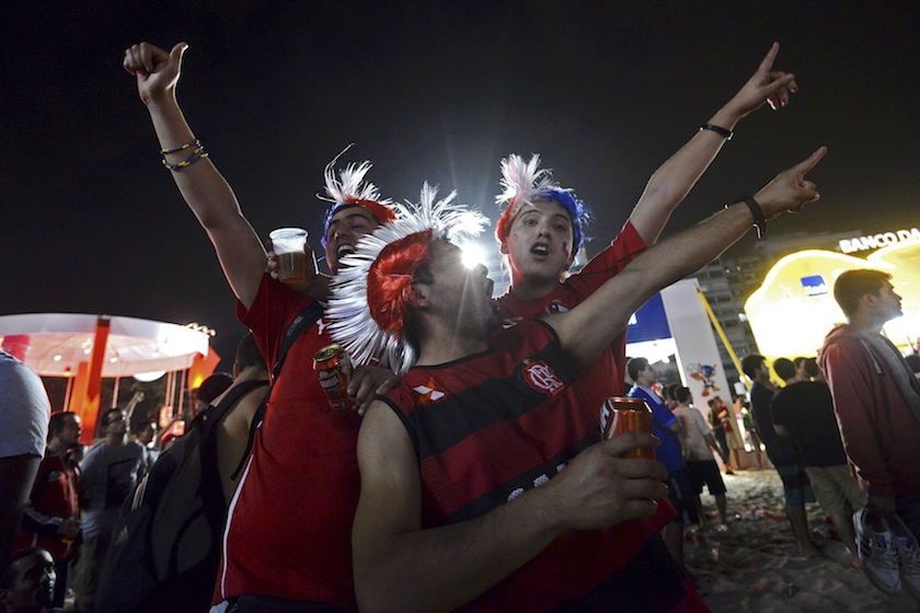 Chile fans celebrate their country's victory over Spain in their match for Group B of the 2014 World Cup, along Copacabana Beach in Rio de Janeiro, June 19, 2014. Chile beat Spain in Rio's Maracana Stadium.u00c2u00a0u00e2u20acu201d Reuters pic