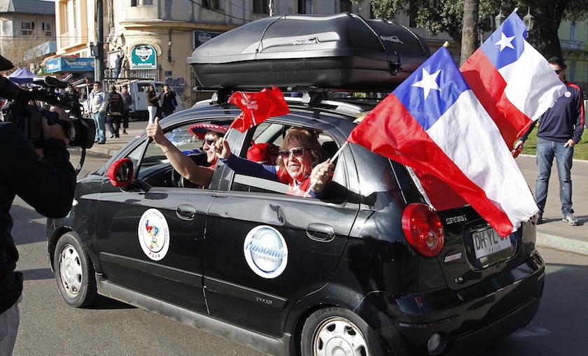 Fans of the Chilean national team, waves to members of the media from a car at the start their travel from Valparaiso city to Brazil for the 2014 World Cup, June 6, 2014. u00e2u20acu201du00c2u00a0Reuters ipc