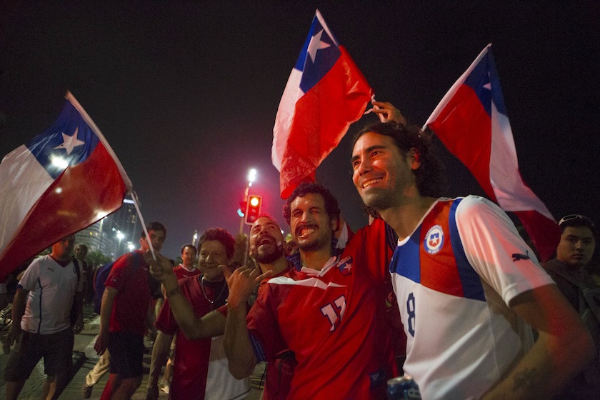 Chile fans celebrate their country's victory over Spain in their match for Group B of the 2014 World Cup, along Copacabana Beach in Rio de Janeiro, June 19, 2014. Chile defeated Spain in Rio's Maracana Stadium. u00e2u20acu201d Reuters pic