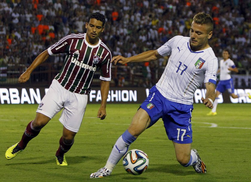Italyu00e2u20acu2122s Ciro Immobile (right) fights for the ball with Fluminenseu00e2u20acu2122s Jean during a friendly match ahead of the 2014 World Cup, in Volta Redonda, Brazil, June 8, 2014. u00e2u20acu201d Reuters pic