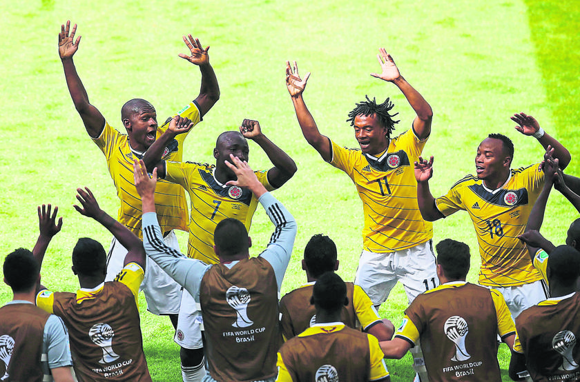 Armero (No. 7) celebrates with teammates after scoring against Greece, June 14, 2014. —Reuters pic