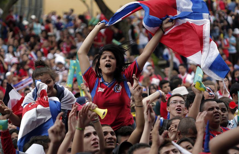 Costa Rican fans celebrate while watching a large screen broadcast of the 2014 World Cup Group D match between Costa Rica and England, in San Jose June 24, 2014. u00e2u20acu201d Reuters pic